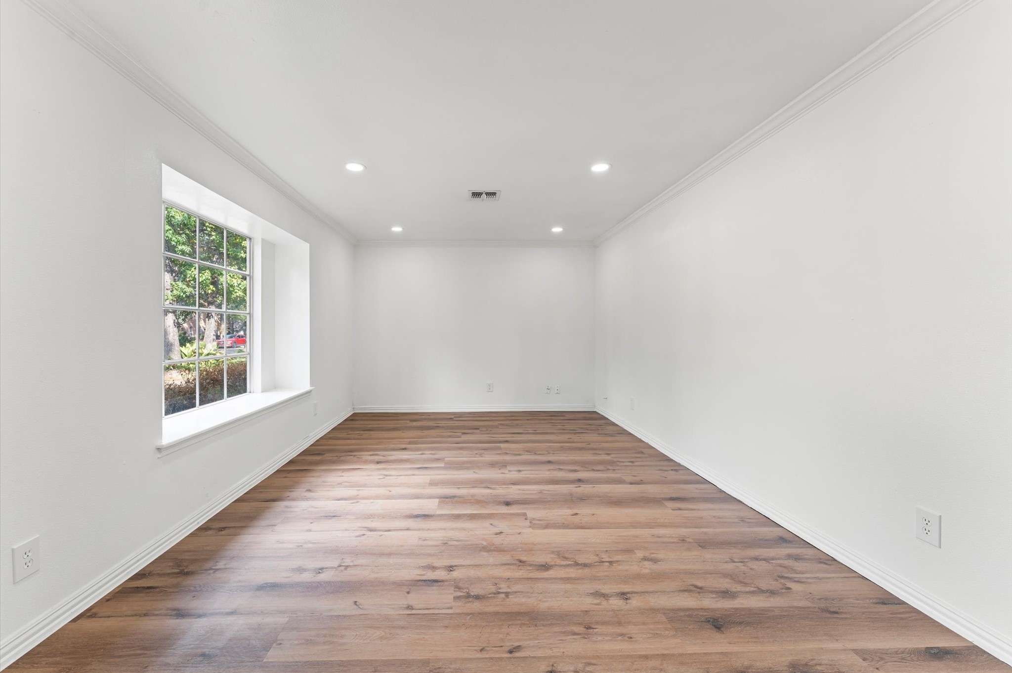 1123 Suwanee Lane Houston, TX 77090 - Photo 6 of 39 a view of empty room with wooden floor and fan
