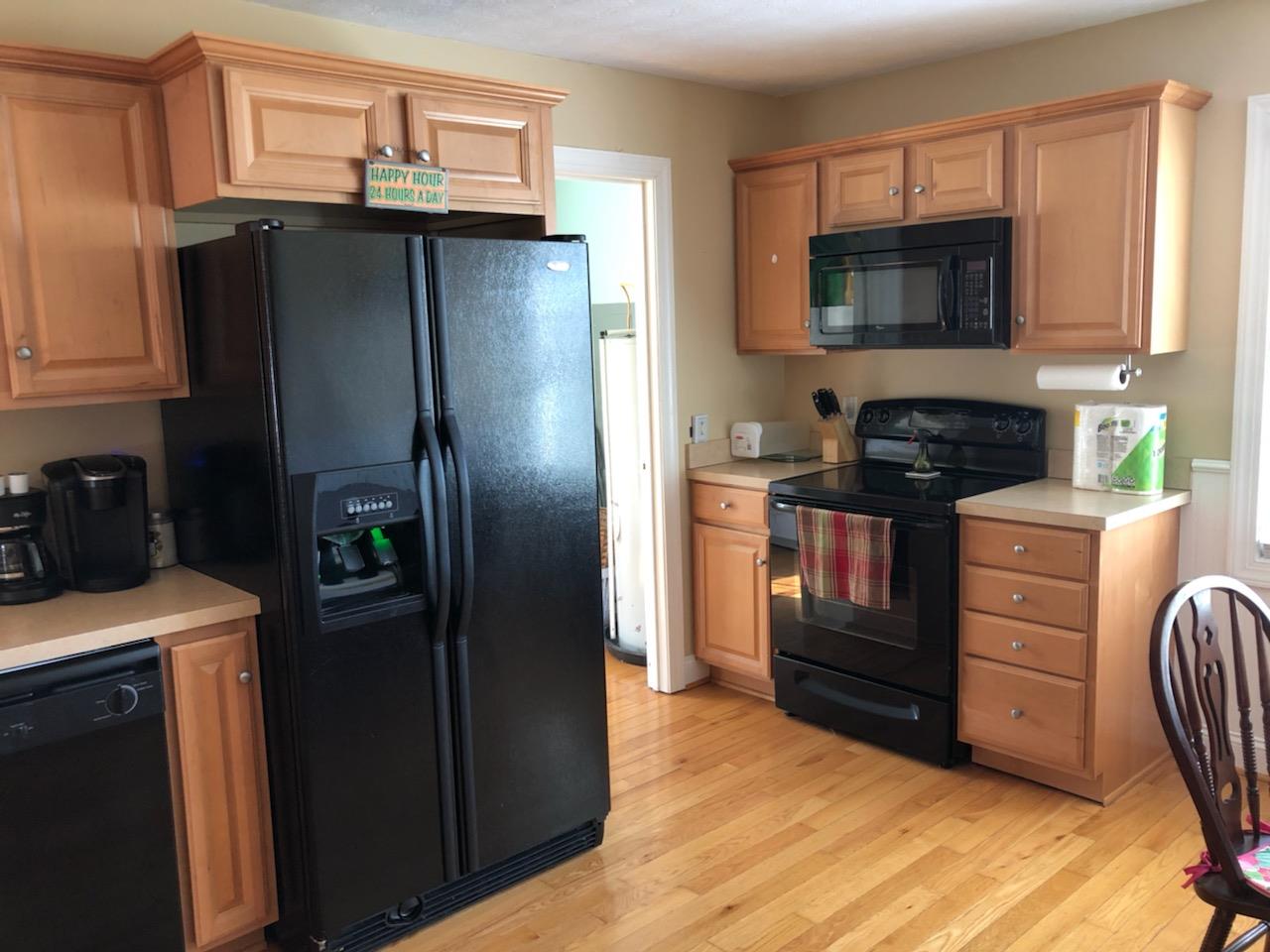 1692 Mt Torrey Road Lyndhurst, VA 22952 - Photo 7 of 14 a kitchen with stainless steel appliances granite countertop a refrigerator stove and microwave