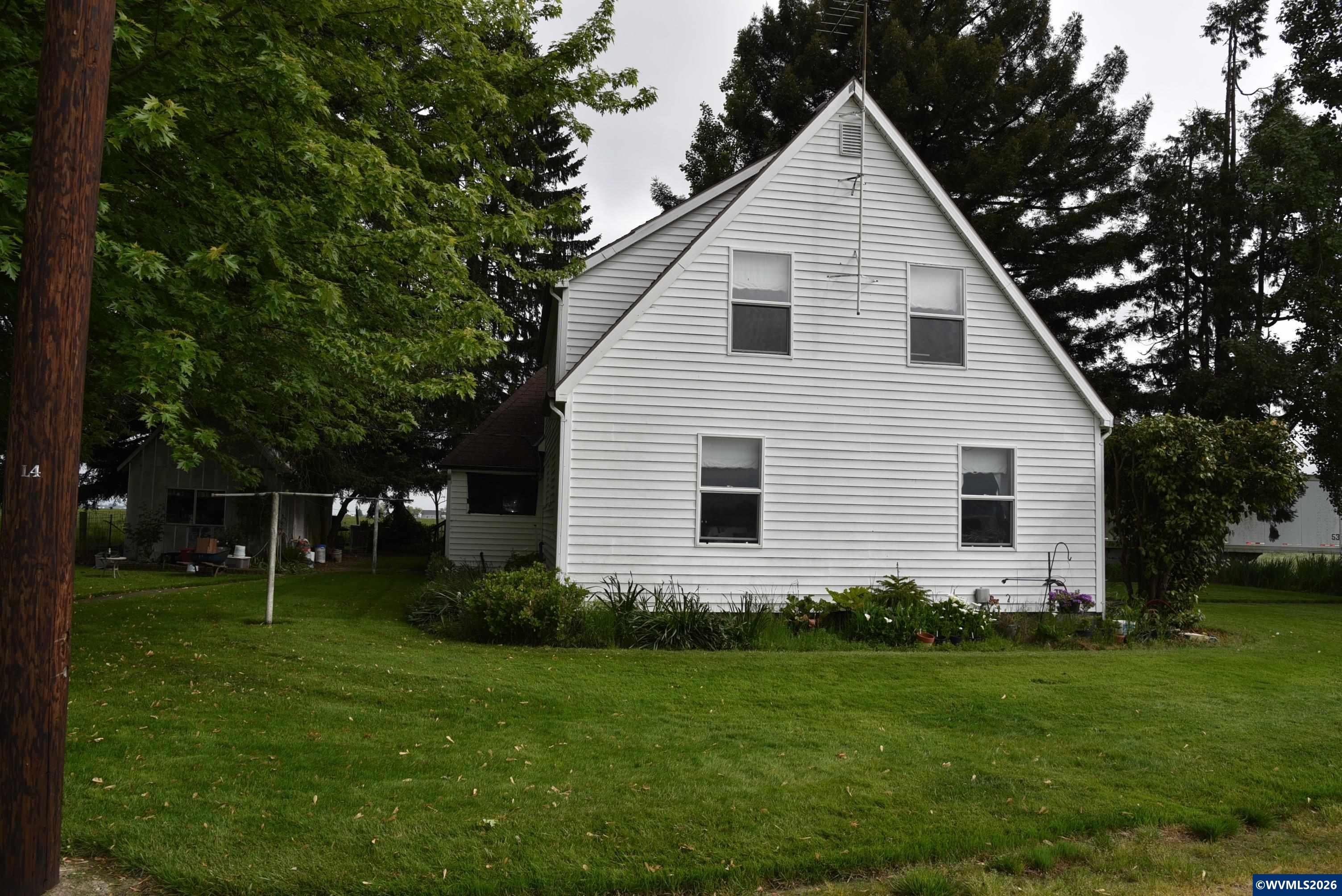 25258 Rowland Road Harrisburg, OR 97446 - Photo 11 of 24 a front view of house with a garden and trees