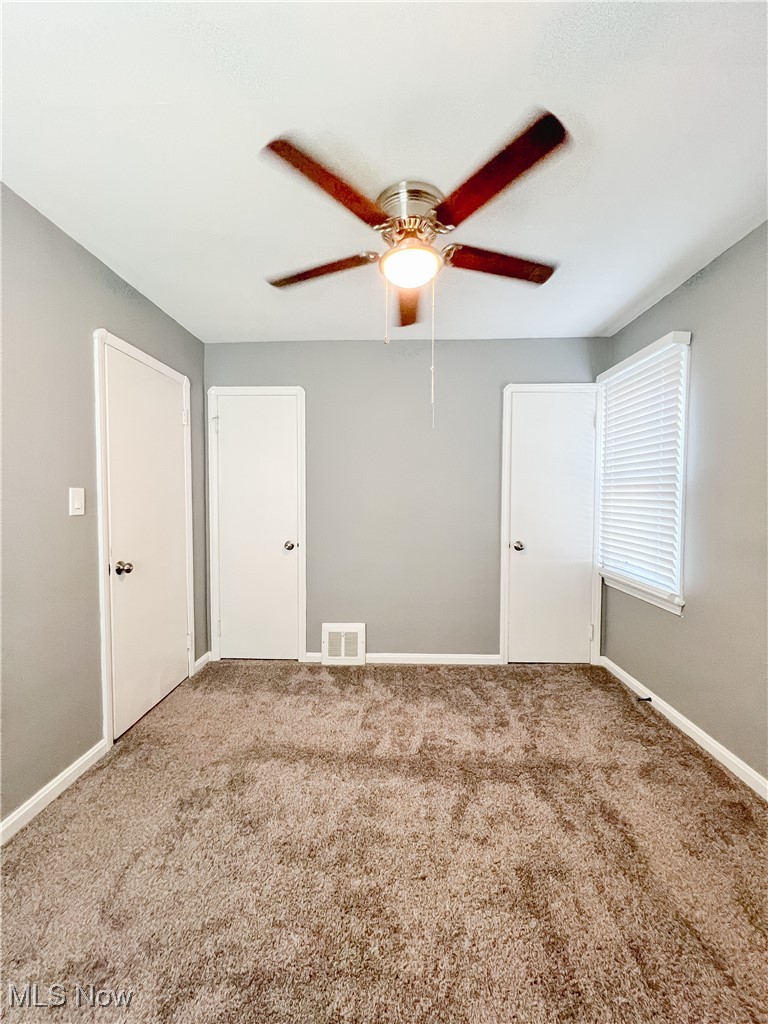 6403 Kenneth Avenue Parma, OH 44129 - Photo 11 of 20 Carpeted bedroom featuring baseboards and ceiling fan