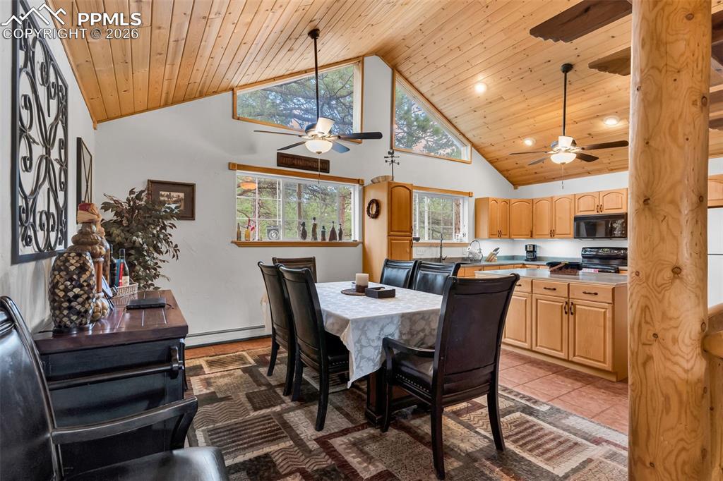 209 Rosewood Road Westcliffe, CO 81252 - Photo 9 of 49 Dining room and kitchen have vaulted ceilings with wood ceiling planks