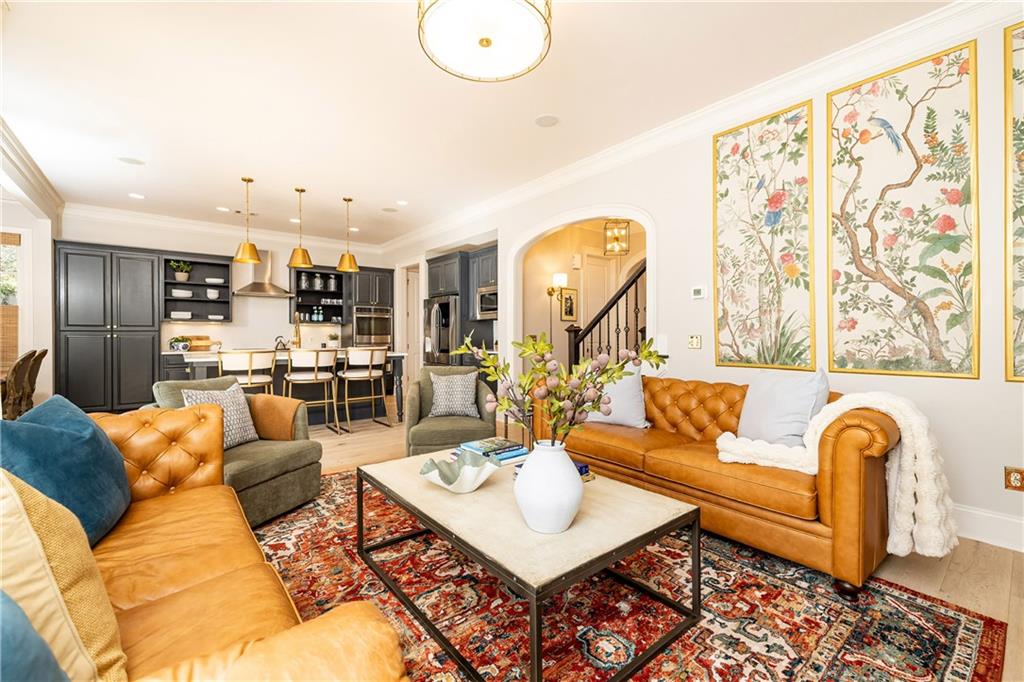 6810 Lullwater Road Cumming, GA 30040 - Photo 14 of 63 a living room with furniture kitchen view and a large window