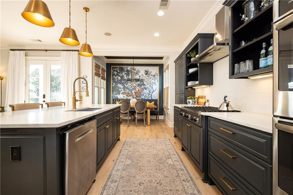 6810 Lullwater Road Cumming, GA 30040 - Photo 16 of 63 a kitchen with stainless steel appliances granite countertop a sink and cabinets