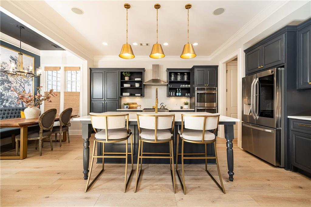6810 Lullwater Road Cumming, GA 30040 - Photo 19 of 63 a view of a dining room with furniture