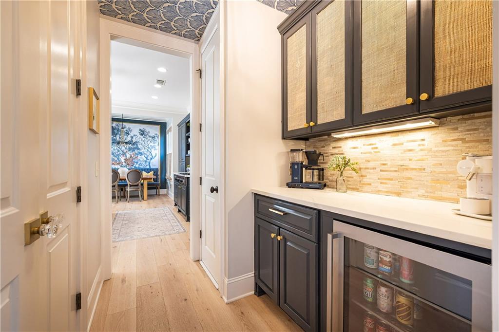 6810 Lullwater Road Cumming, GA 30040 - Photo 21 of 63 a kitchen with stainless steel appliances granite countertop a refrigerator and a sink