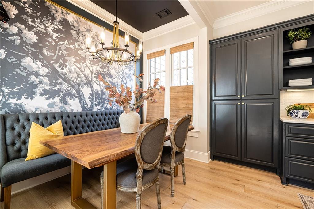 6810 Lullwater Road Cumming, GA 30040 - Photo 23 of 63 a view of a dining room with furniture and a window