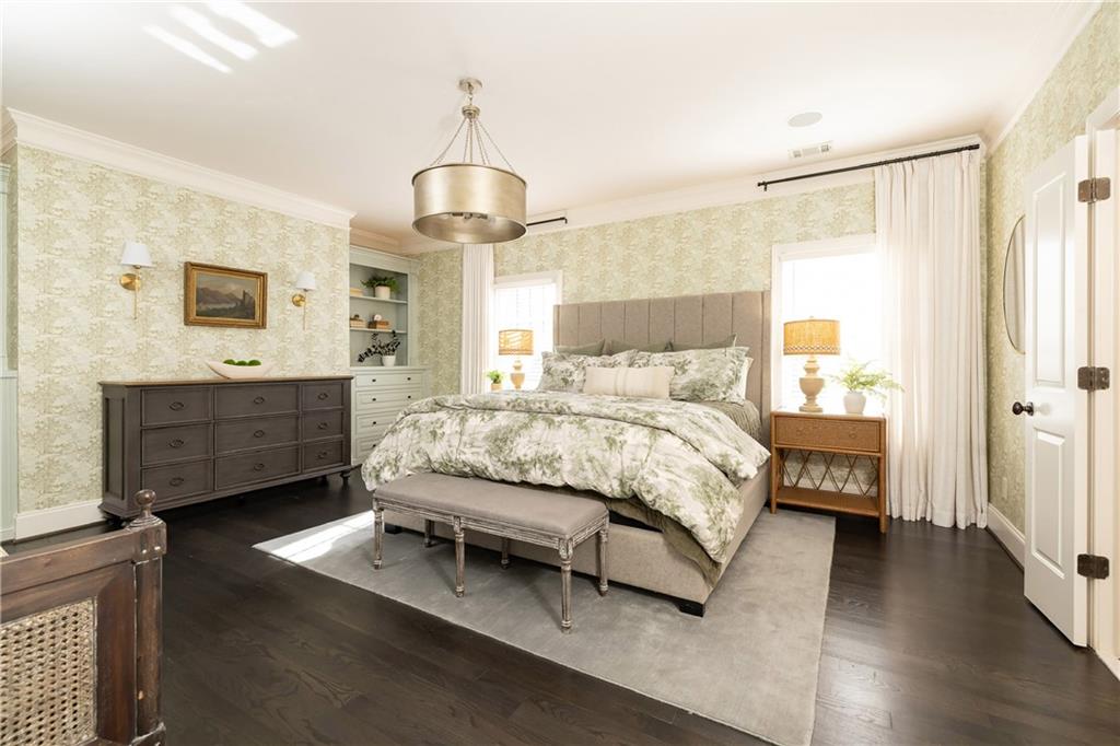 6810 Lullwater Road Cumming, GA 30040 - Photo 25 of 63 a bedroom with a bed chandelier and a window