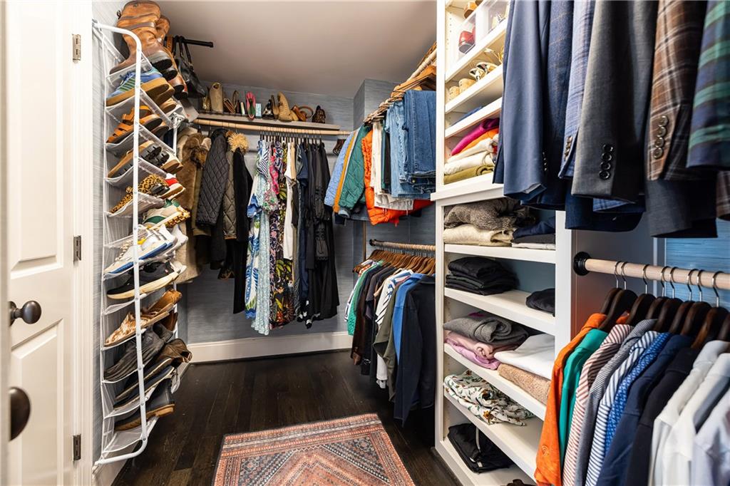 6810 Lullwater Road Cumming, GA 30040 - Photo 28 of 63 a view of walk in closet with clothes and shoes
