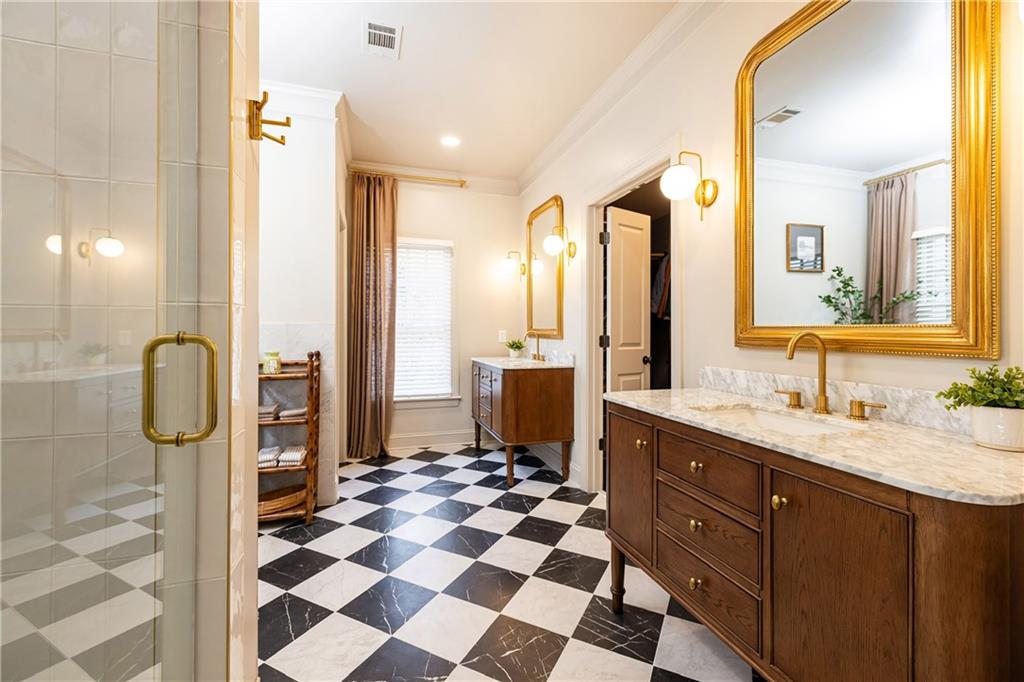 6810 Lullwater Road Cumming, GA 30040 - Photo 33 of 63 a bathroom with a double vanity sink mirror and shower