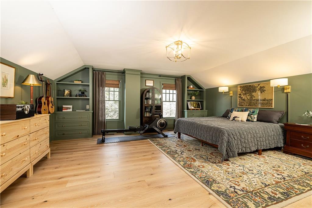 6810 Lullwater Road Cumming, GA 30040 - Photo 41 of 63 a spacious bedroom with a large bed and a dresser