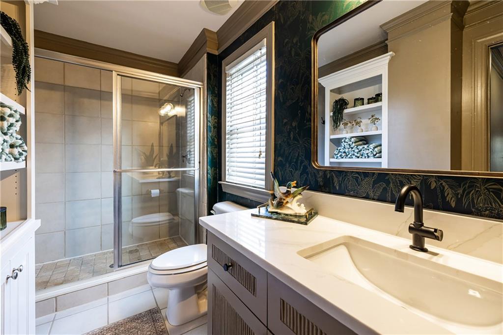 6810 Lullwater Road Cumming, GA 30040 - Photo 43 of 63 a bathroom with a sink toilet and shower