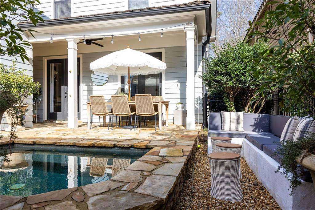 6810 Lullwater Road Cumming, GA 30040 - Photo 52 of 63 a view of a patio with chairs and tables
