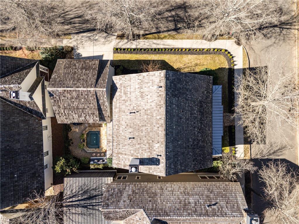 6810 Lullwater Road Cumming, GA 30040 - Photo 57 of 63 a front view of a building with large trees