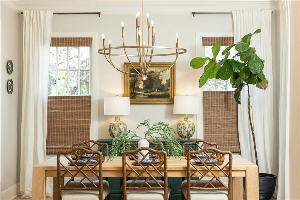 6810 Lullwater Road Cumming, GA 30040 - Photo 8 of 63 a vase of flowers sitting on a table with chairs