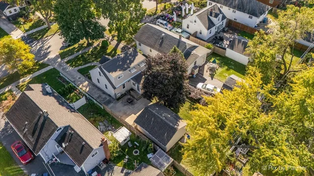 an aerial view of residential houses with outdoor space