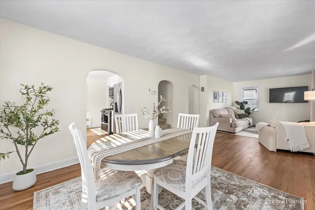 a view of a dining room with furniture and wooden floor