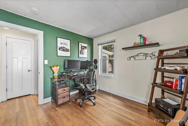 a workspace with furniture and wooden floor