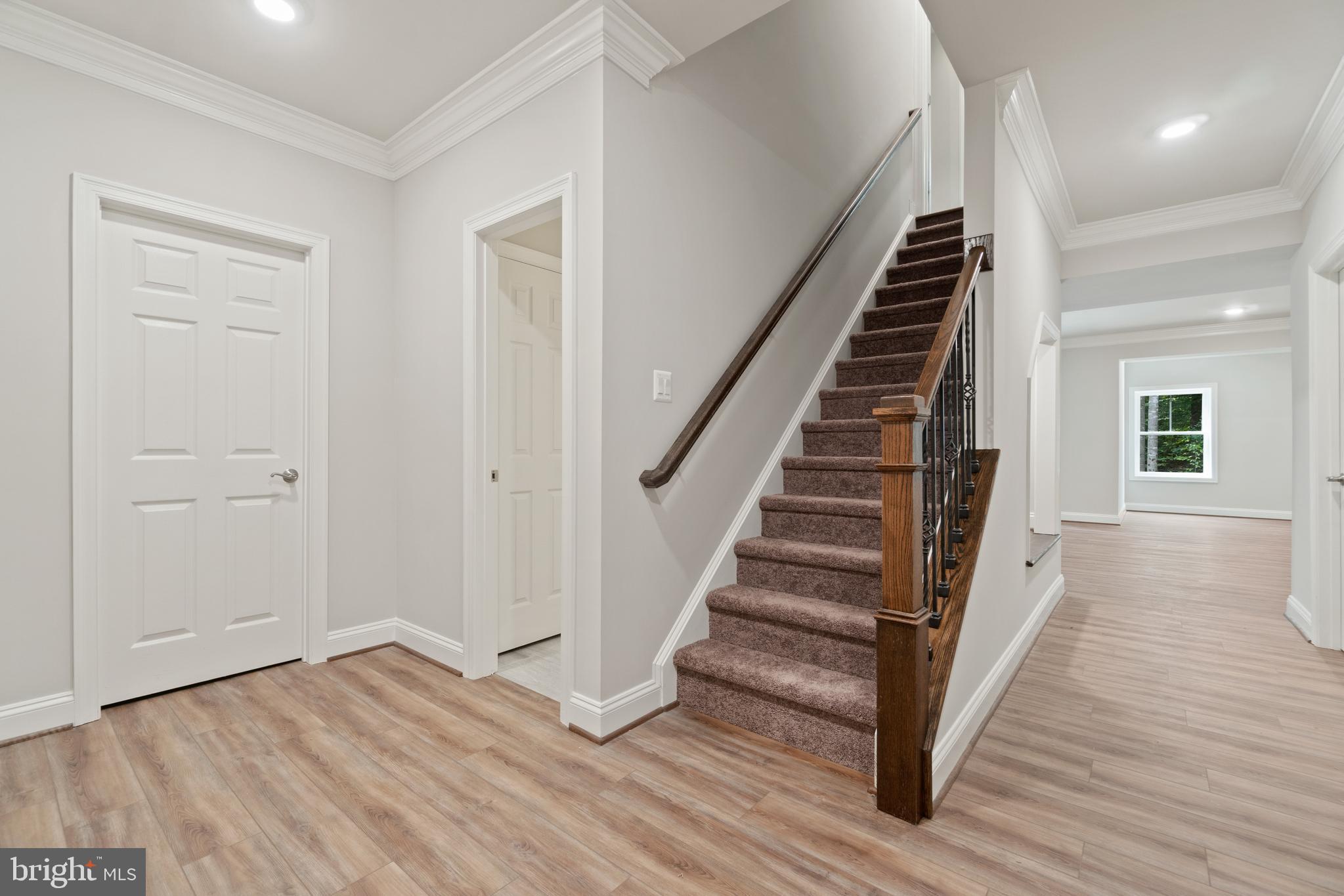 13741 Orlando Road Nokesville, VA 20181 - Photo 21 of 41 wooden floor in an empty room with stairs