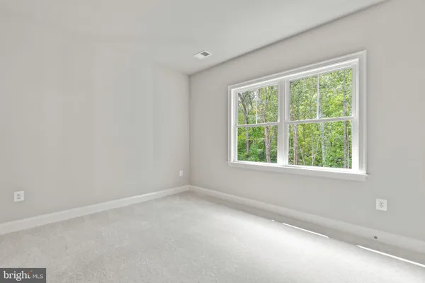 a view of a hallway with windows