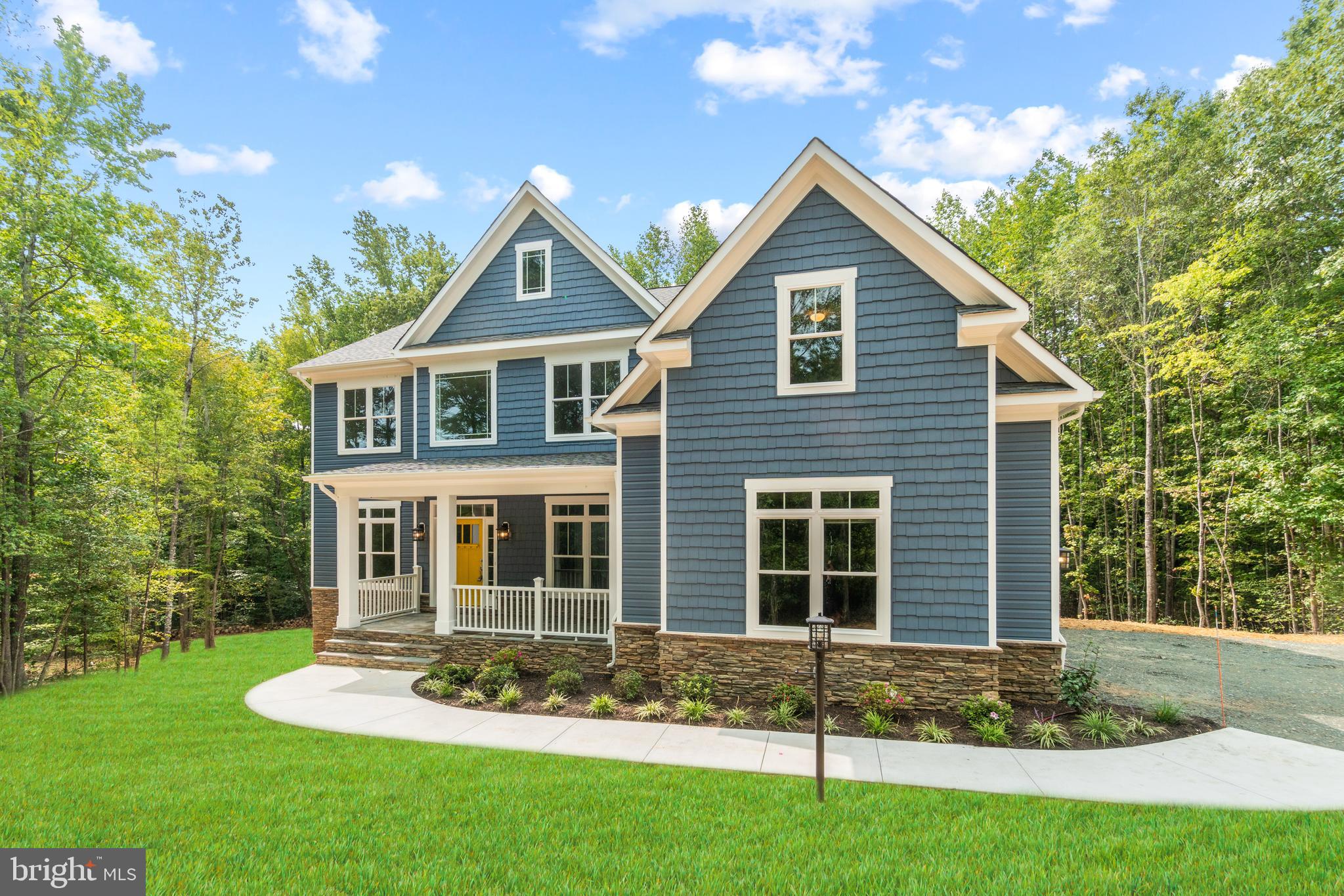 13741 Orlando Road Nokesville, VA 20181 - Photo 3 of 41 a front view of a house with a yard