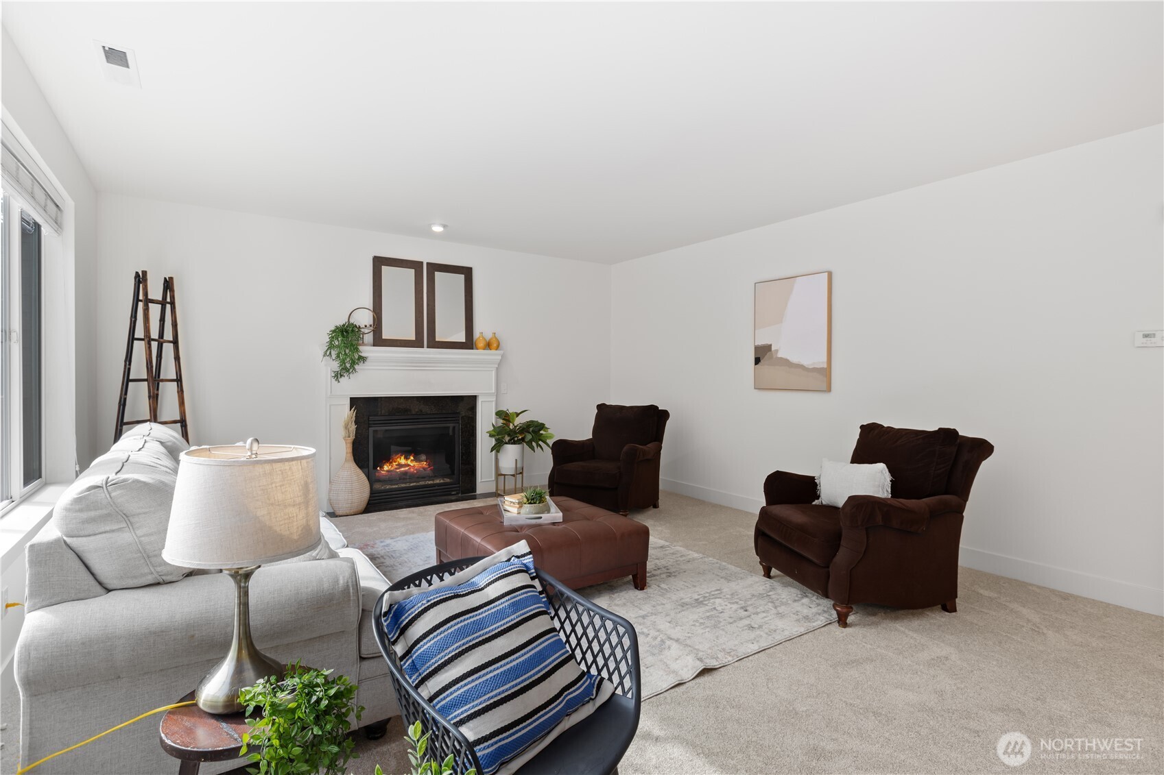 22829 36th Avenue Southeast Bothell, WA 98021 - Photo 17 of 39 a living room with furniture and a fireplace