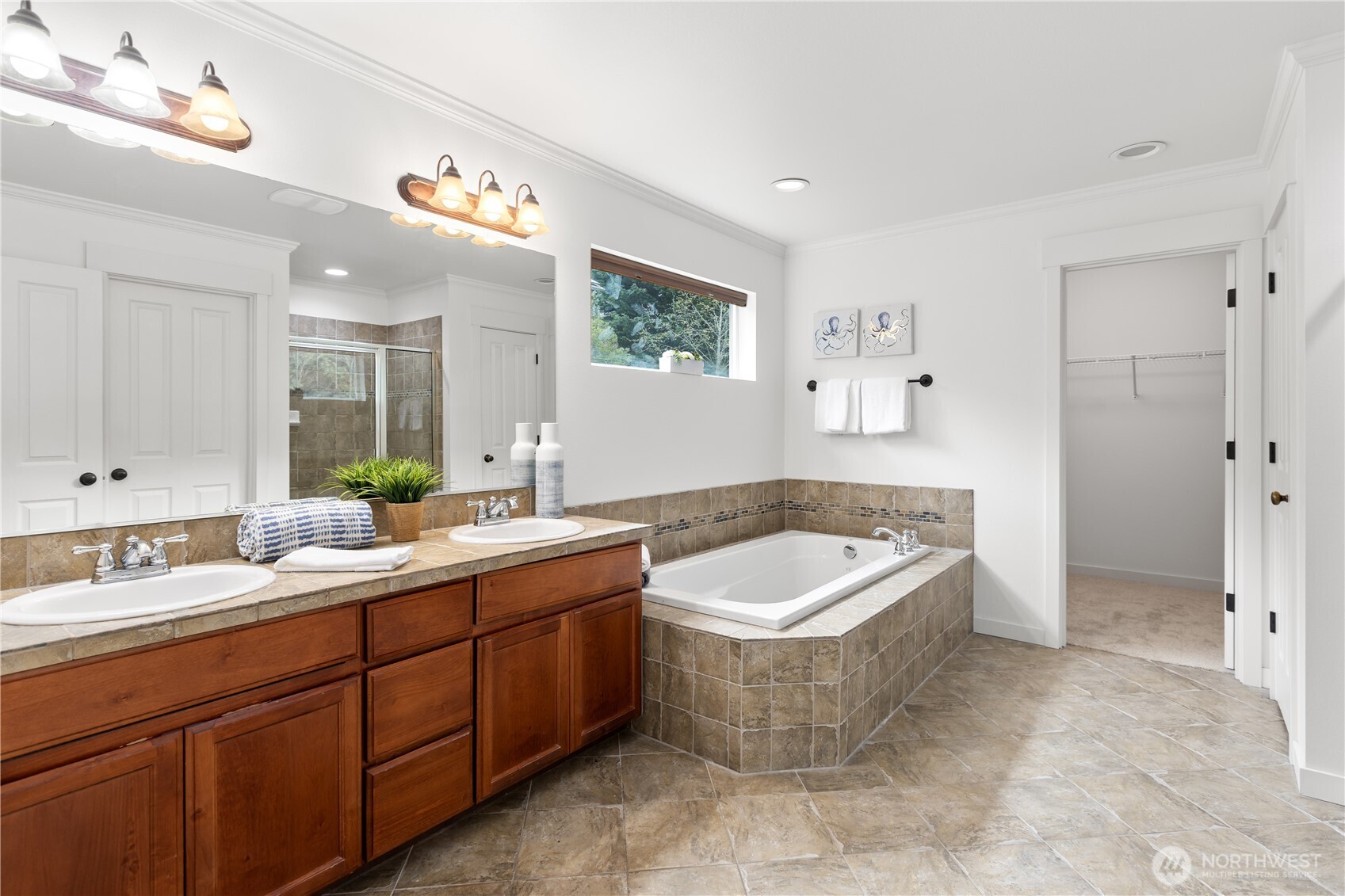22829 36th Avenue Southeast Bothell, WA 98021 - Photo 23 of 39 a spacious bathroom with a tub a sink and mirror