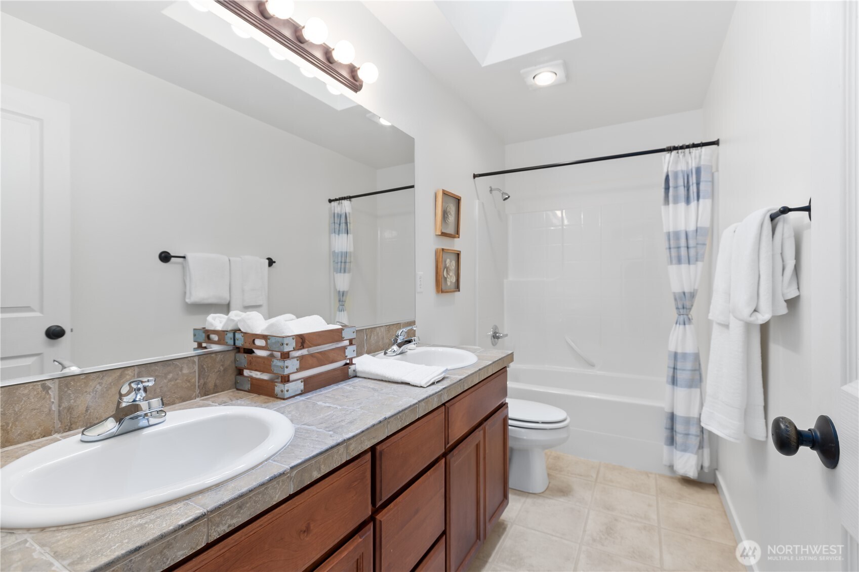 22829 36th Avenue Southeast Bothell, WA 98021 - Photo 27 of 39 a bathroom with a double vanity sink toilet mirror and shower