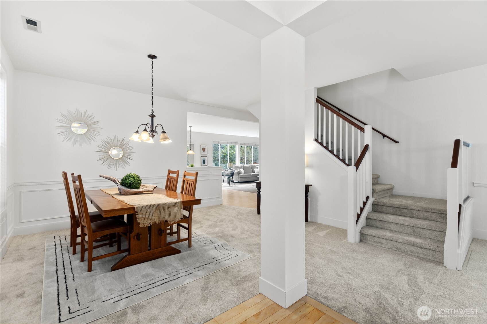 22829 36th Avenue Southeast Bothell, WA 98021 - Photo 5 of 39 a view of a dining room and livingroom with furniture wooden floor a chandelier