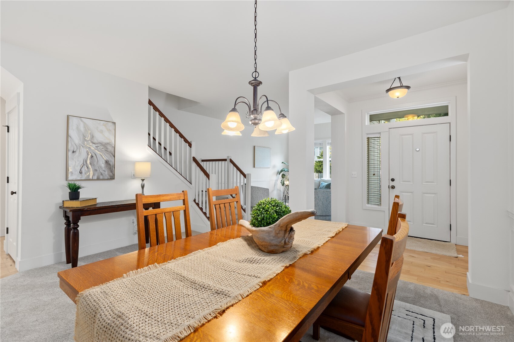 22829 36th Avenue Southeast Bothell, WA 98021 - Photo 6 of 39 a view of a dining room with furniture and a chandelier