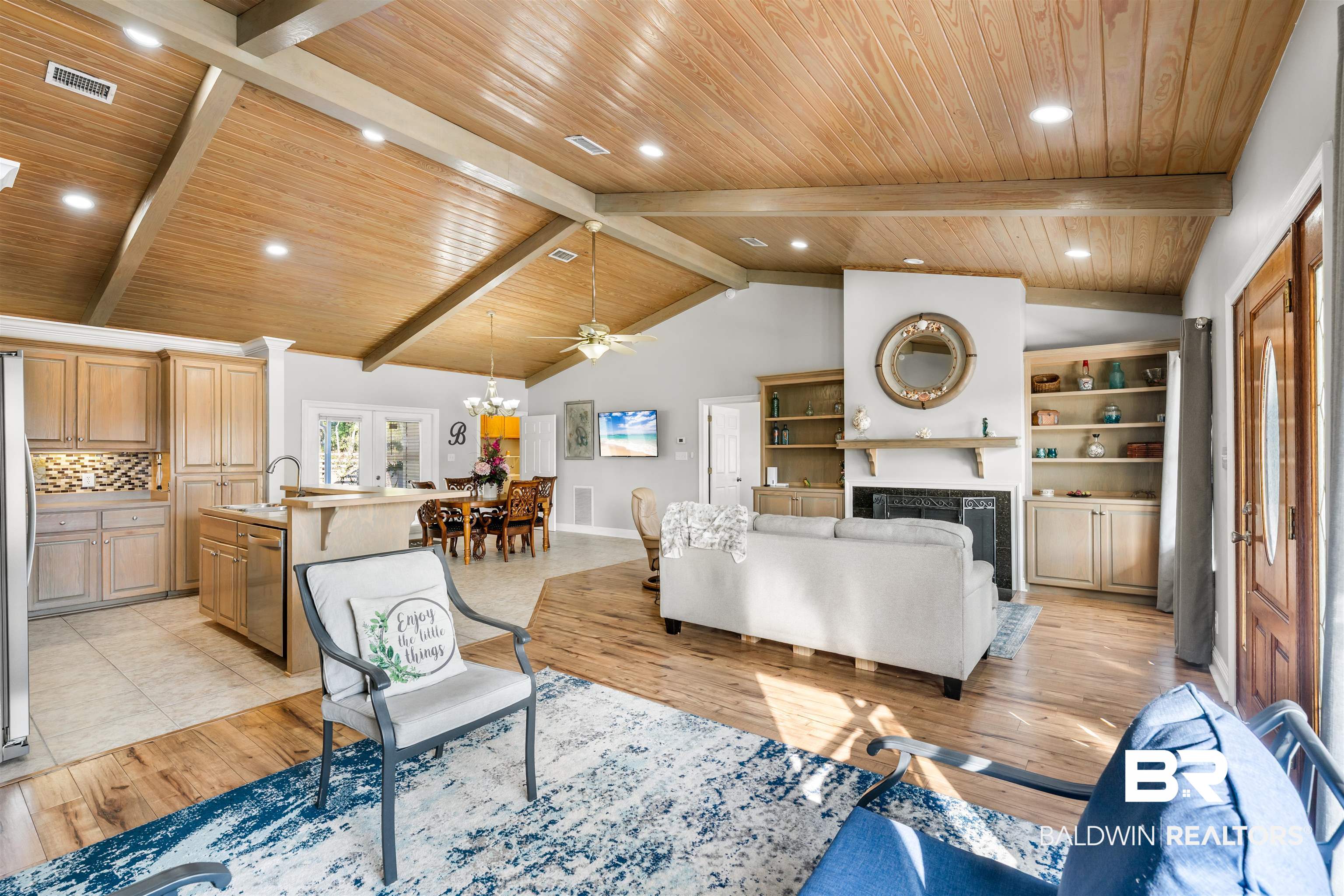 19079 Baldwin County Road 10 Foley, AL 36535 - Photo 8 of 37 Living room featuring ceiling fan, a fireplace, light wood finished floors, a high wood beamed ceiling, and suspended lighting