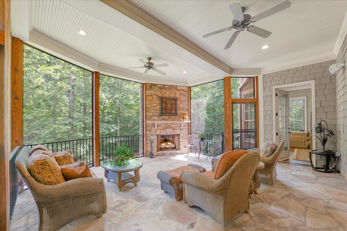 9712 Honeycutt Road Raleigh, NC 27614 - Photo 18 of 83 The Perfect place to start the day or relax in the evening. Gas Fireplace with Flagstone Flooring. Just bring your own book and a refreshing drink ! Screened Porch