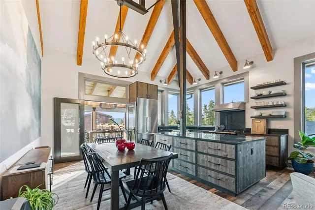 a view of a dining room with furniture window and outside view