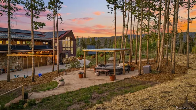 a view of a lake with a bench and table chair