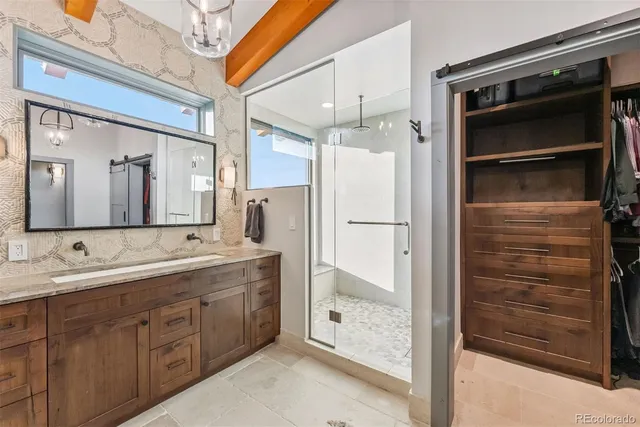 a bathroom with a double vanity sink and mirror