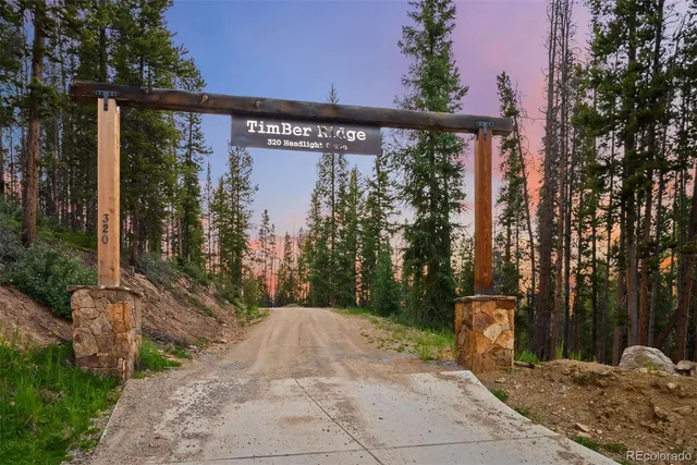 a view of a street with trees in front of it