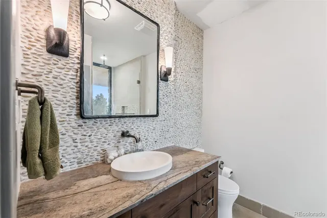 a bathroom with a double vanity sink and mirror