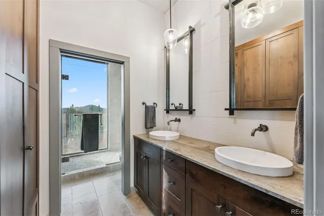 front view of a brick building with a yard