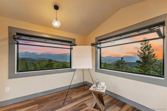 a living room with large windows