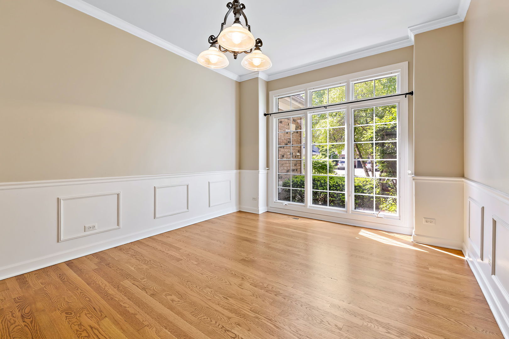 2531 Spartina Road Naperville, IL 60564 - Photo 12 of 39 a view of an empty room with a window and hardwood floor