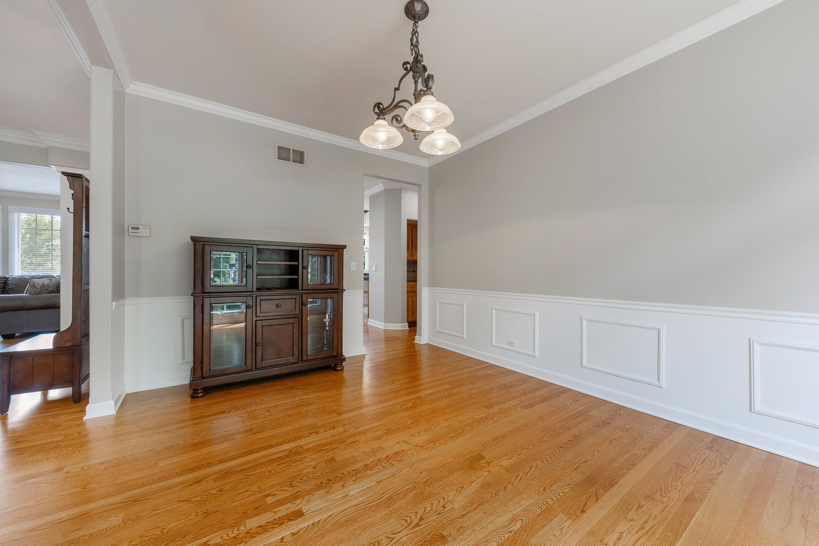 2531 Spartina Road Naperville, IL 60564 - Photo 13 of 39 a view of an empty room with window and wooden floor
