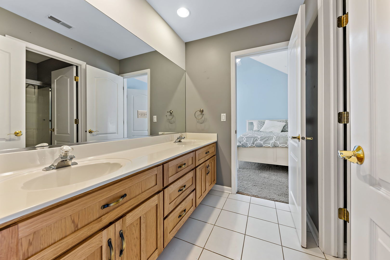2531 Spartina Road Naperville, IL 60564 - Photo 22 of 39 a spacious bathroom with a double vanity sink and a mirror