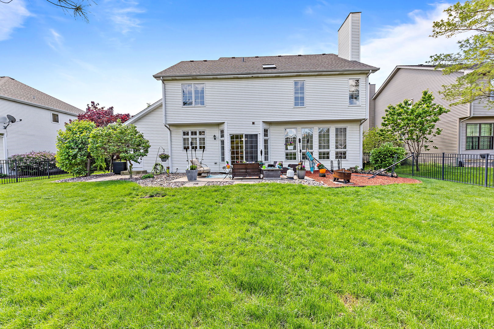 2531 Spartina Road Naperville, IL 60564 - Photo 30 of 39 a view of a house with a big yard and potted plants