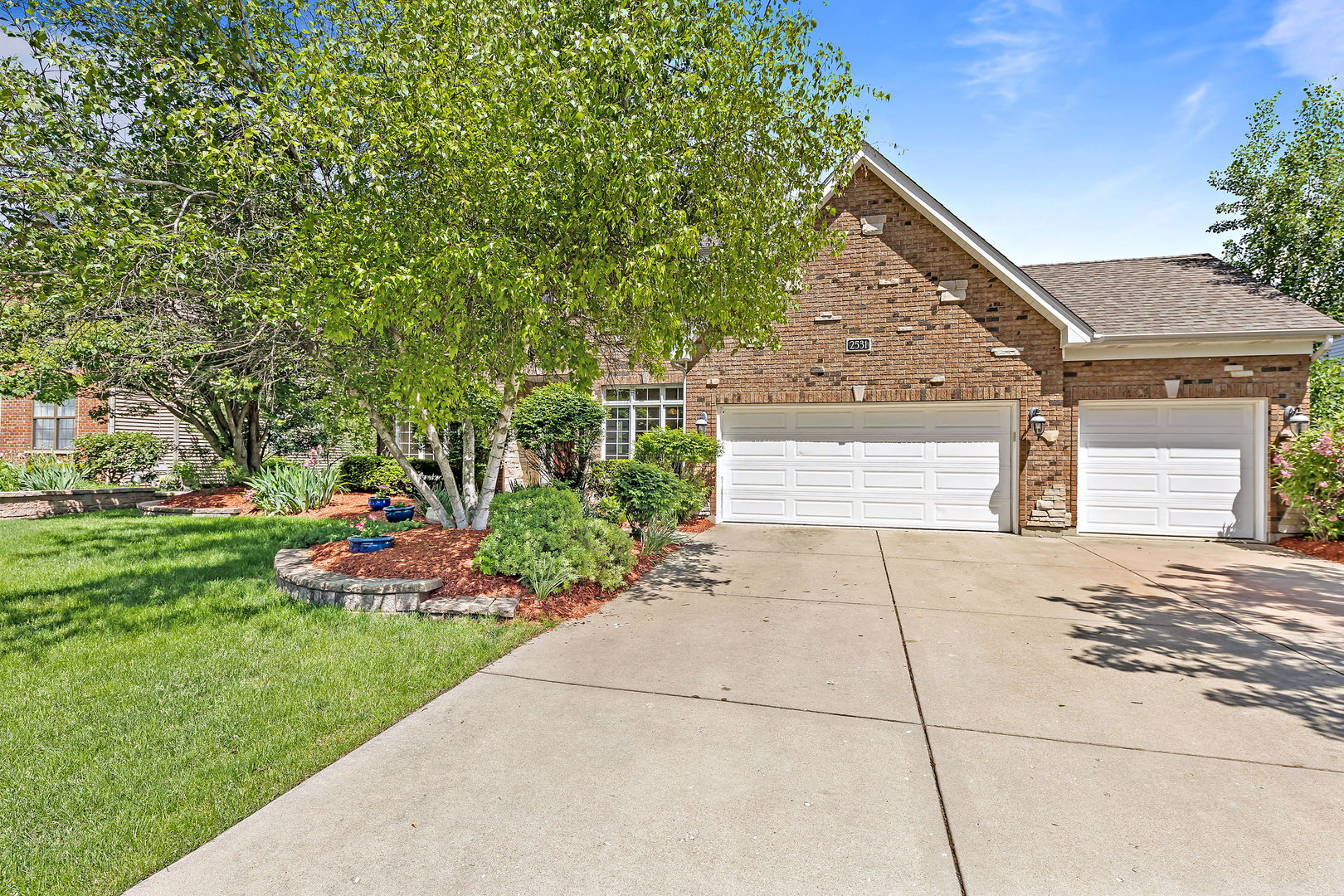 2531 Spartina Road Naperville, IL 60564 - Photo 31 of 39 a front view of a house with a yard and outdoor seating