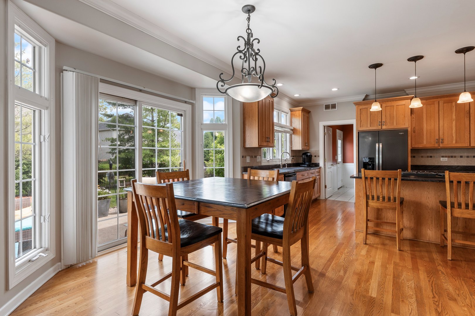 2531 Spartina Road Naperville, IL 60564 - Photo 7 of 39 a view of a dining room with furniture window and wooden floor