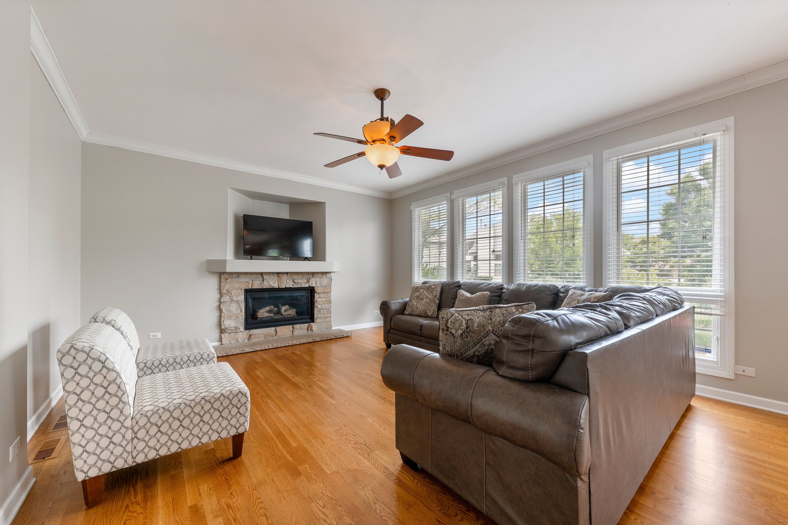 2531 Spartina Road Naperville, IL 60564 - Photo 8 of 39 a living room with furniture a fireplace and a large window
