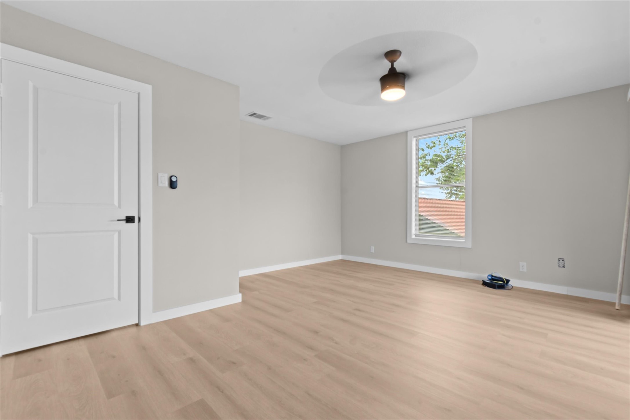 9100 Highway 183 Austin, TX 78747 - Photo 26 of 38 A window overlooks the neighborhood from this space with light wood flooring and clean trim.
