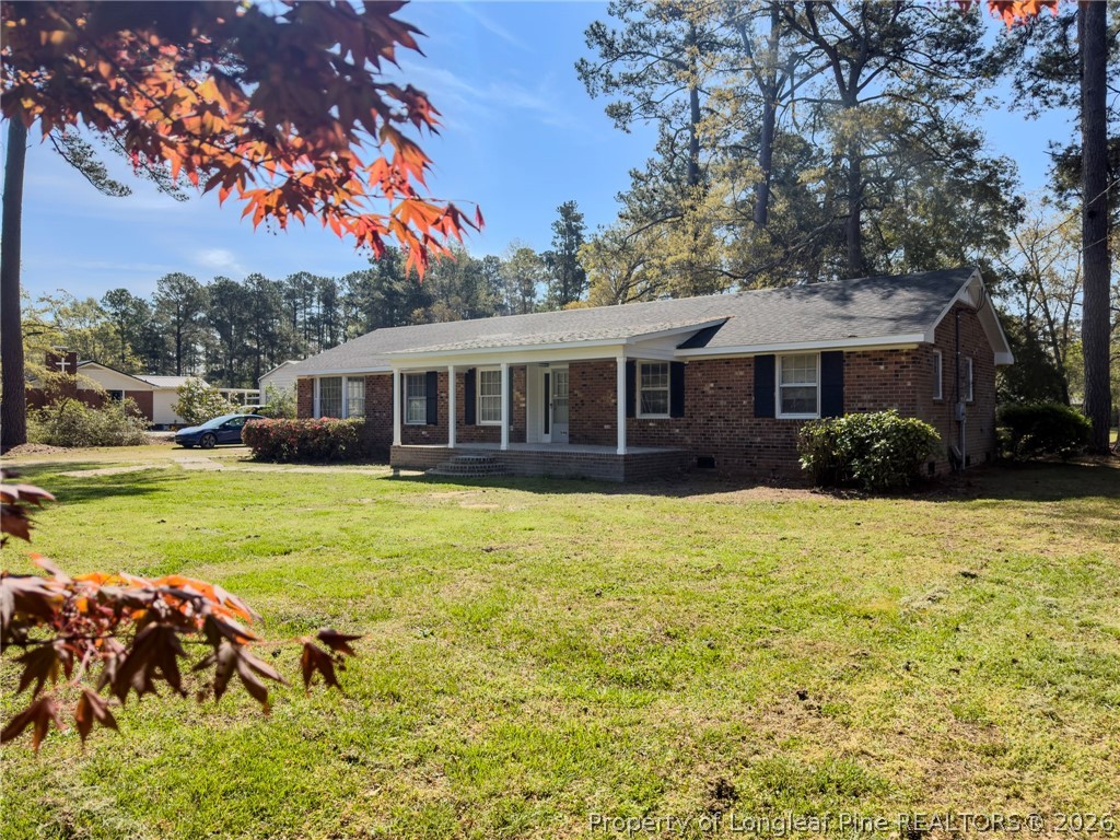 598 Forest Road Lumberton, NC 28358 - Photo 19 of 25 a view of a house with pool plants and large trees