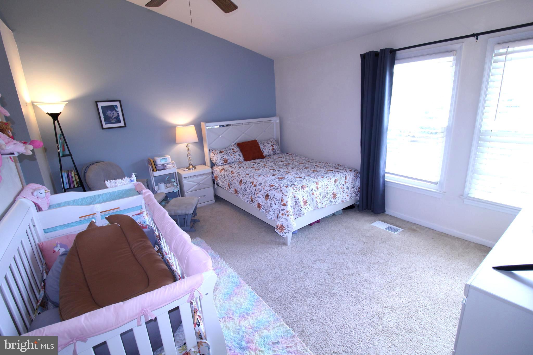 7863 Apache Ridge Court Manassas, VA 20109 - Photo 16 of 38 a bedroom with two beds and a window