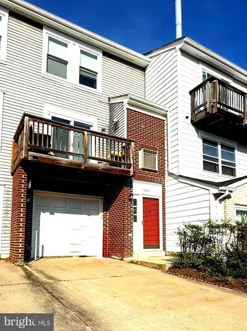 a view of house with garage