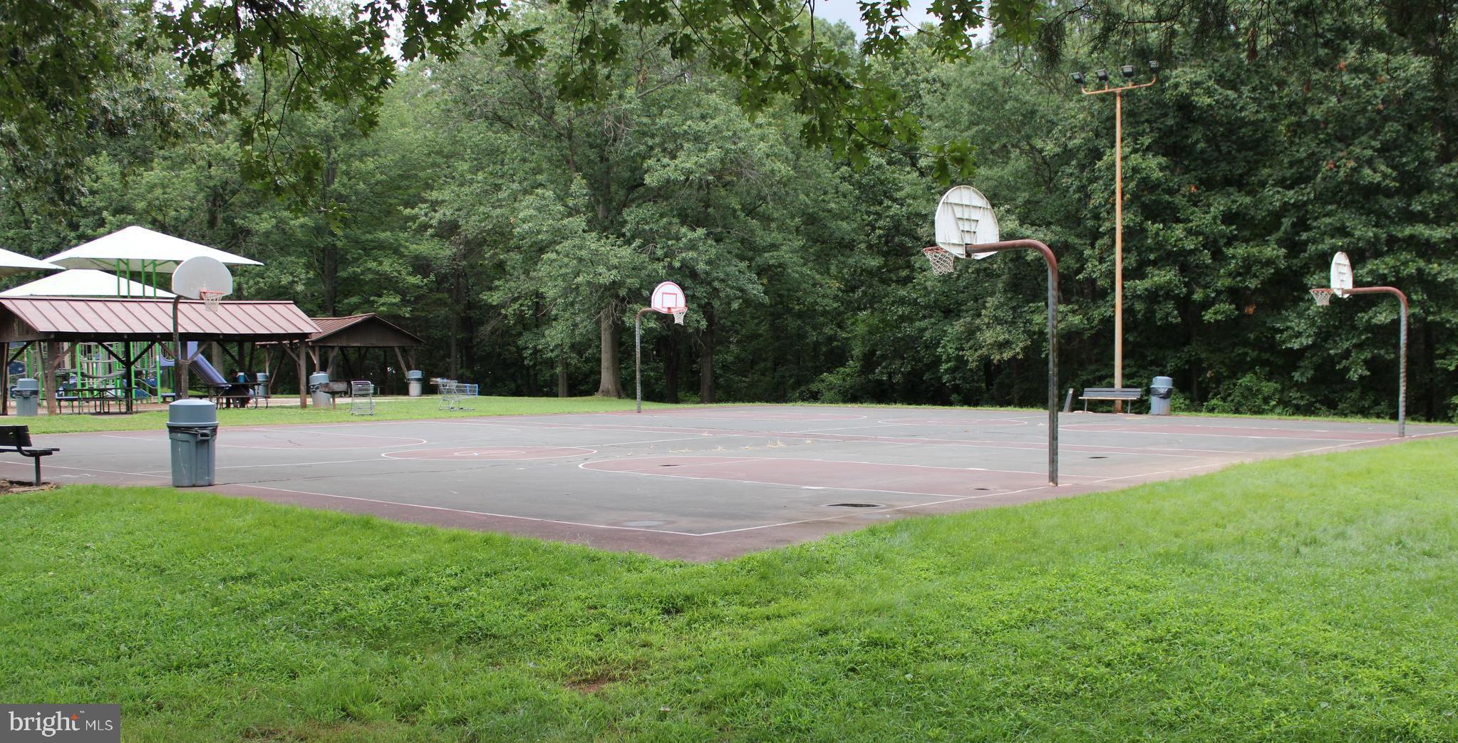 7863 Apache Ridge Court Manassas, VA 20109 - Photo 34 of 38 a swimming pool with outdoor seating and yard